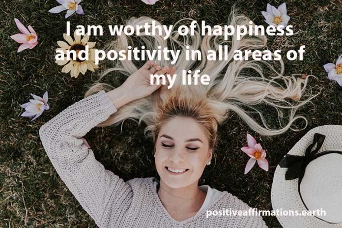 positivity in my life happy woman lying on grass